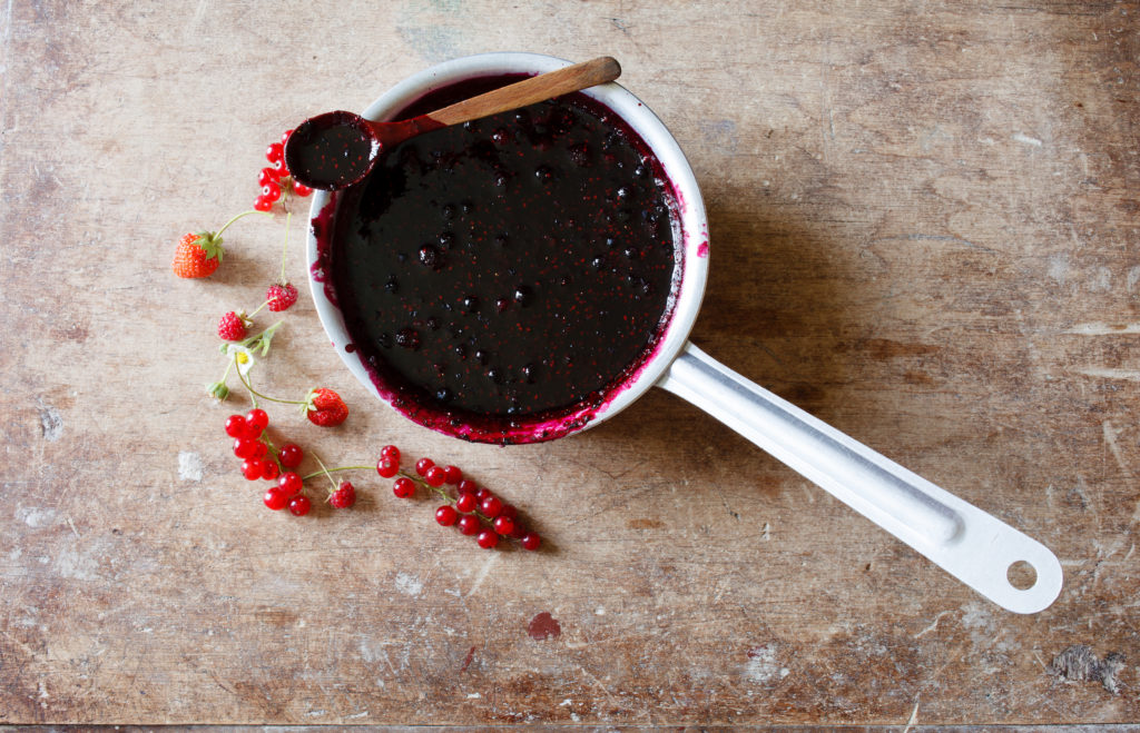 Learn how to make your own elderberry syrup, nature's potent remedy to fight off colds and the flu and boost your immune system with it's healing properties.